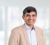 Vijay Ratnaparkhe, der CIO der Robert Bosch GmbH, lächelt in die Kamera